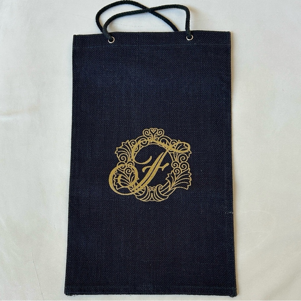 Elegant Burlap Bag with Gold-Colored Floral monogram of the letter "F"